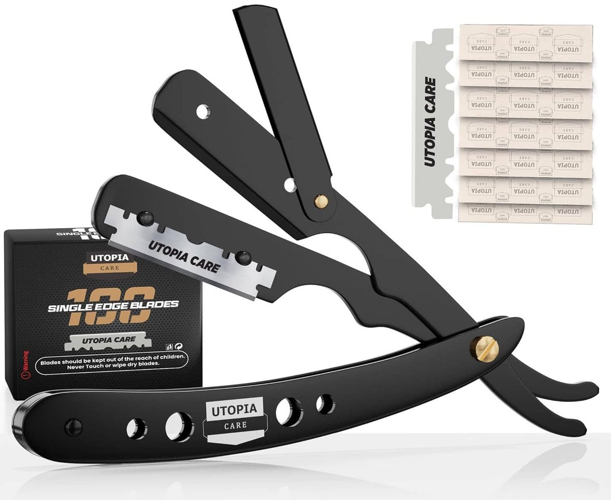 Black barber straight razor with open blade, shown with spare UTOPIA CARE blades