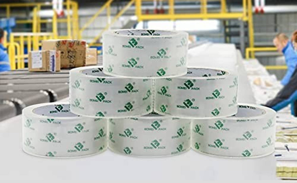 Clear packing tape refill rolls with green logo print, stacked for packing