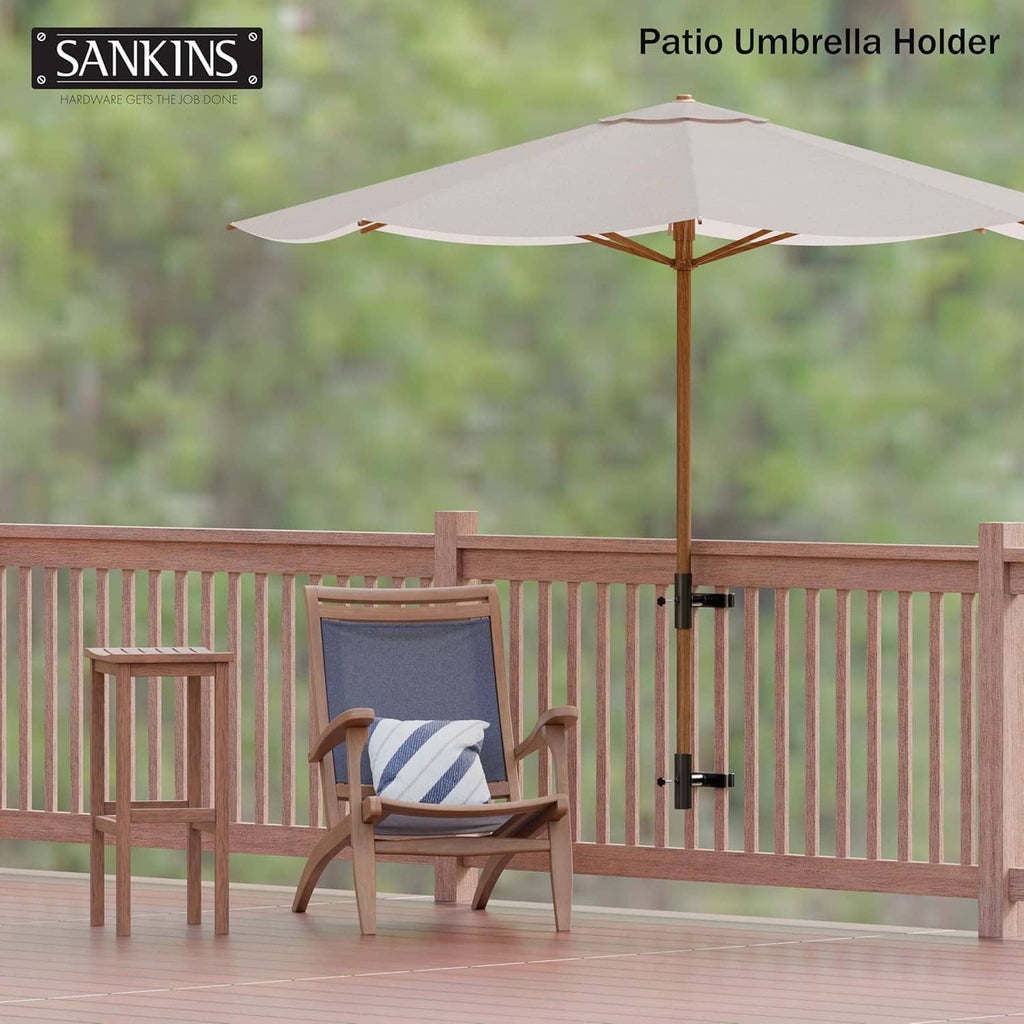 Patio umbrella holder mounted on wooden deck railing with pole in black base.