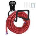 Black metal wall-mounted hose hanger with U-shaped cradle holding a red garden hose loop