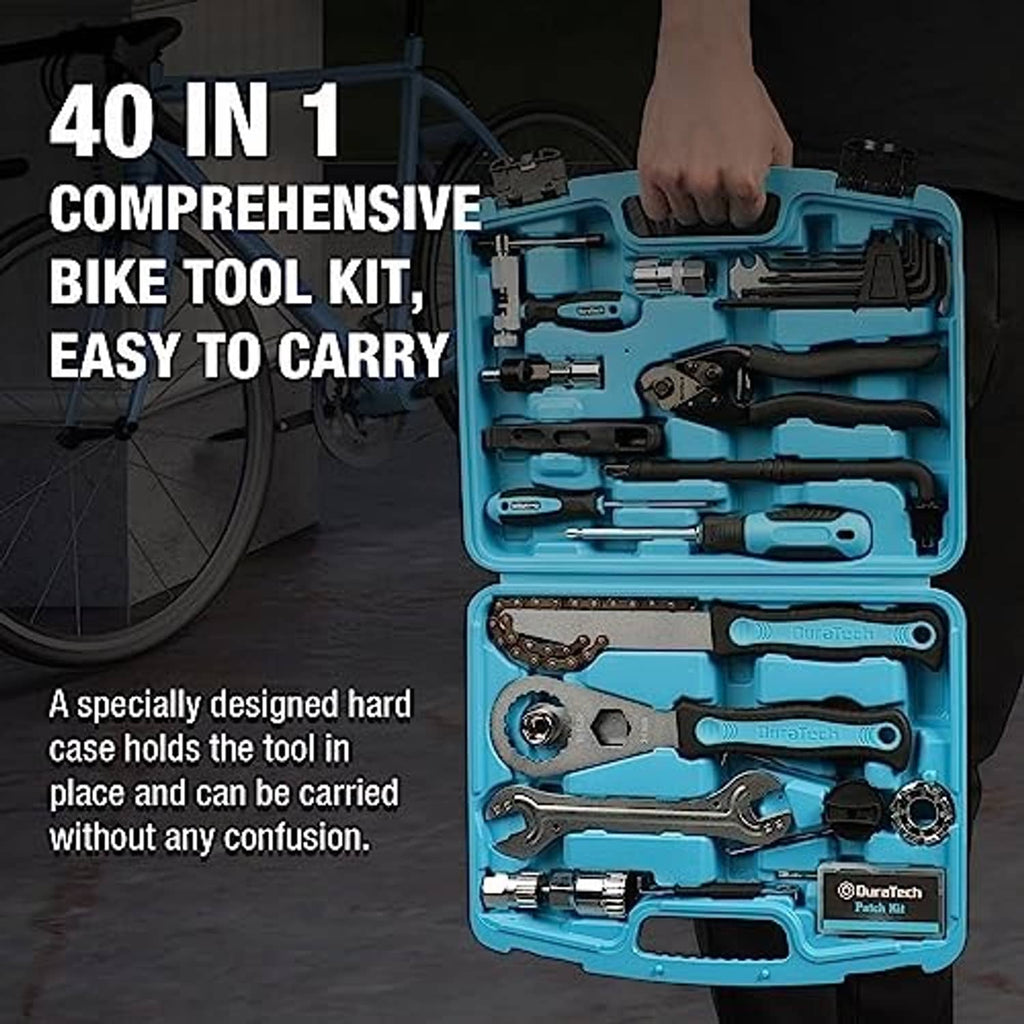Teal bike tool kit case open showing wrenches, sockets, and a tire repair tool