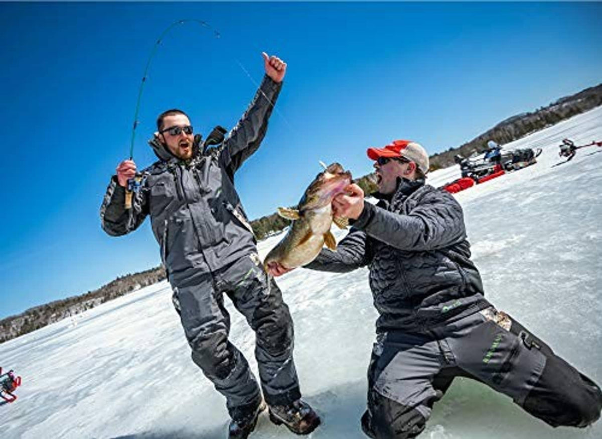 Ice fishing anglers holding rods with fishing line and caught fish