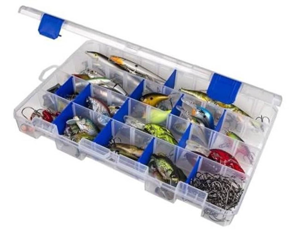 Clear tackle box with blue dividers and assorted fishing lures inside