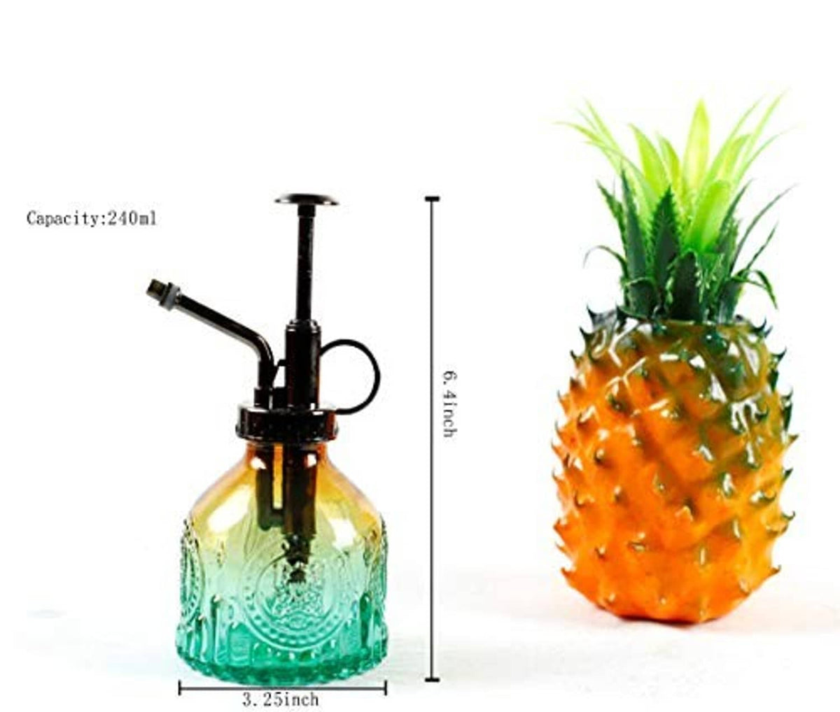 Vintage glass plant mister spray bottle with green ribbed body and black pump head.