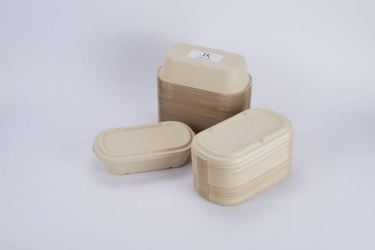 Light beige disposable food containers with snap-on lids, neatly stacked