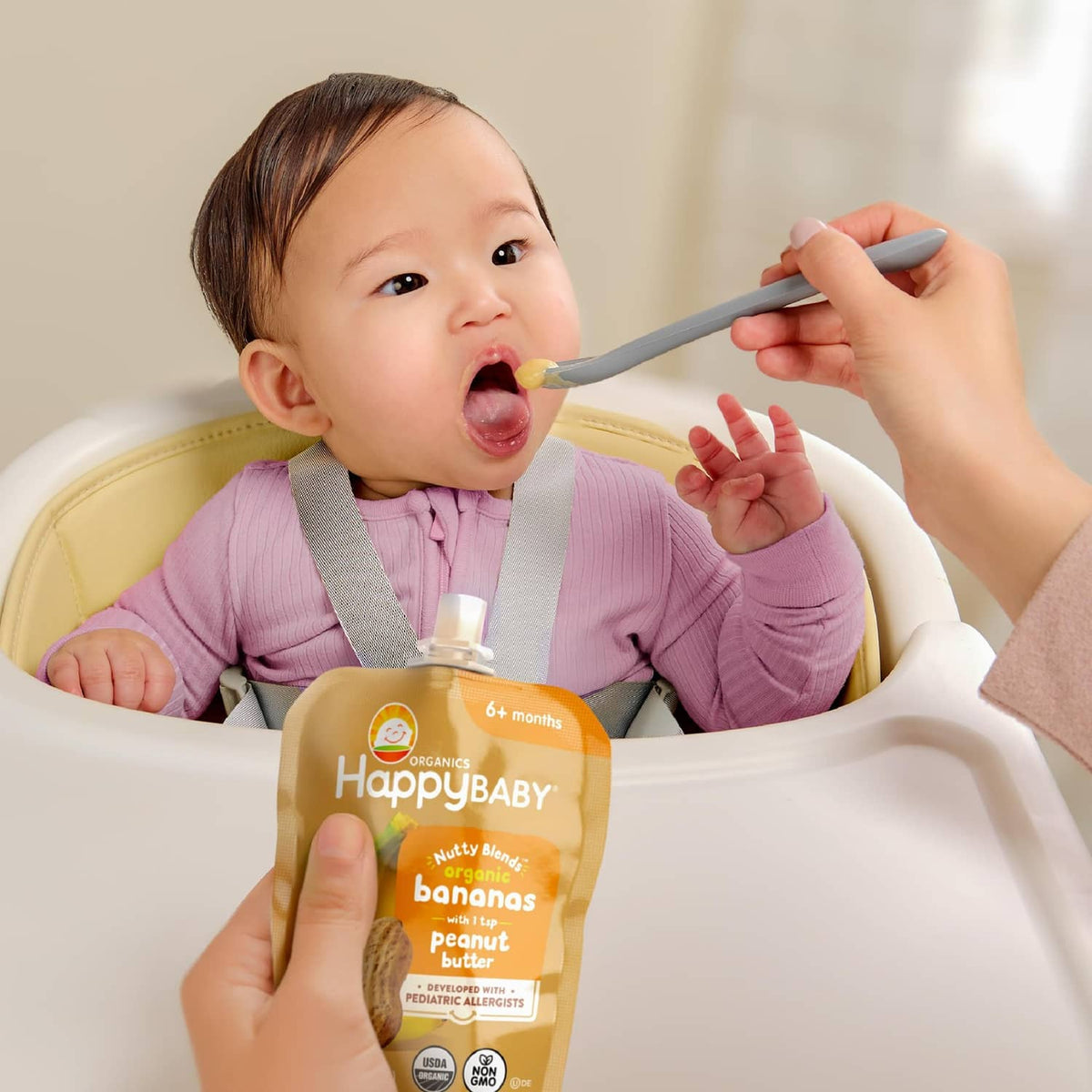 Baby tasting HappyBABY Stage 2 nutty blends pouch, 64 months, bananas with peanut butter