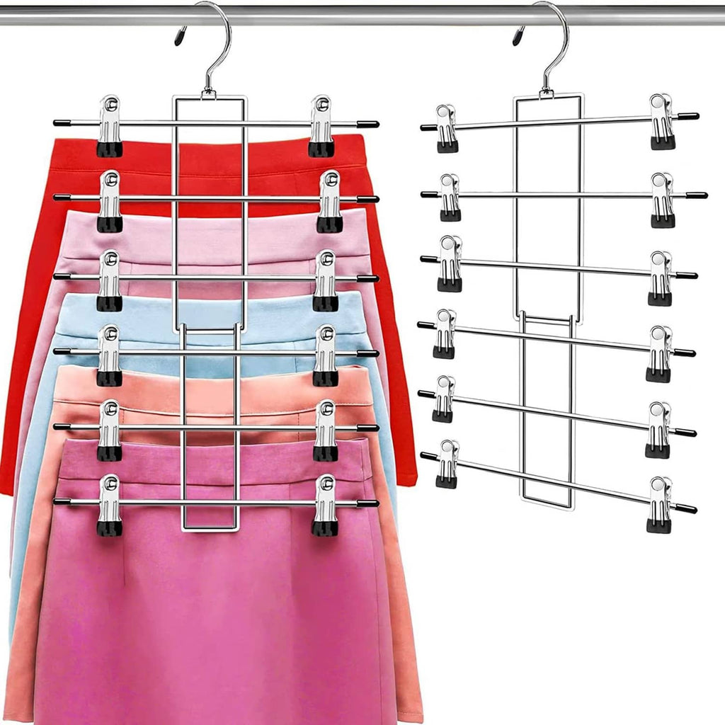 Chrome pants hanger rack with clips holding folded pants in a row