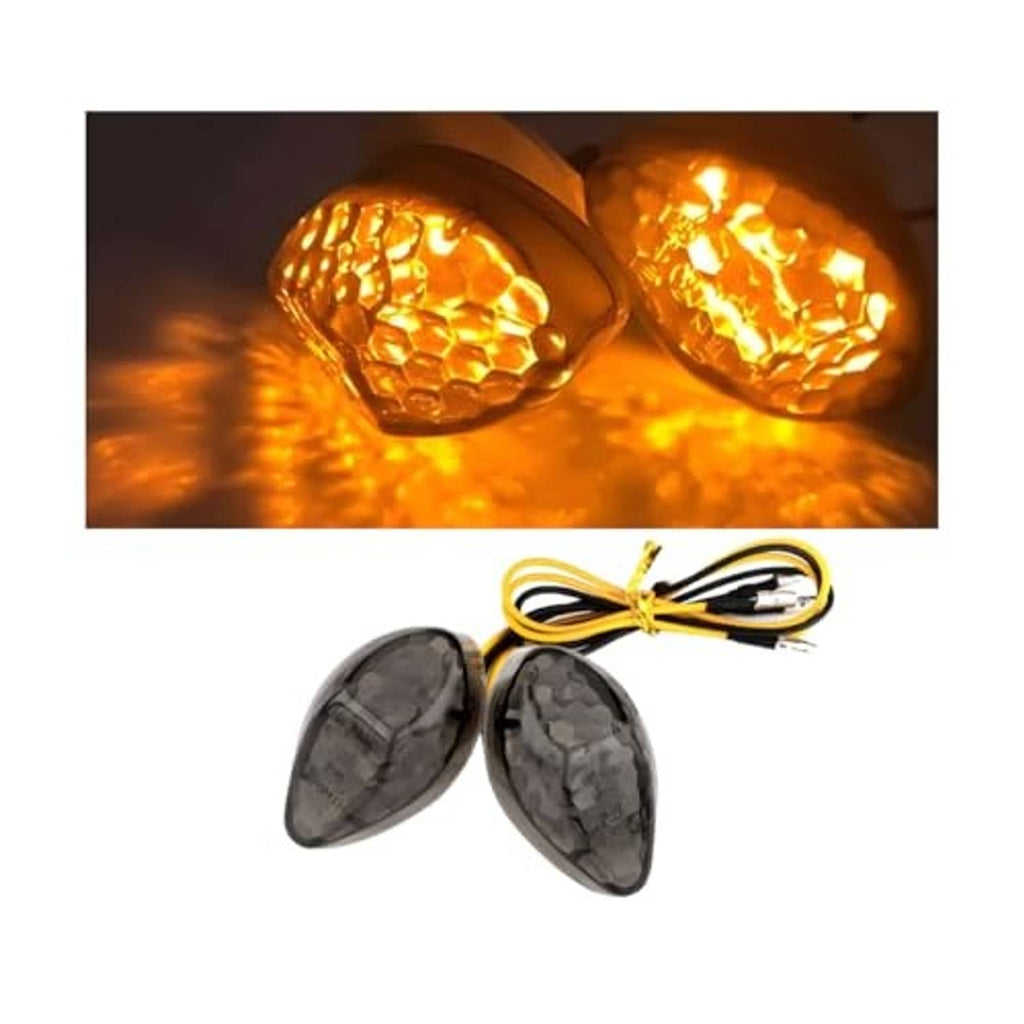 Two black LED turn signals with clear amber lens and attached wiring harness
