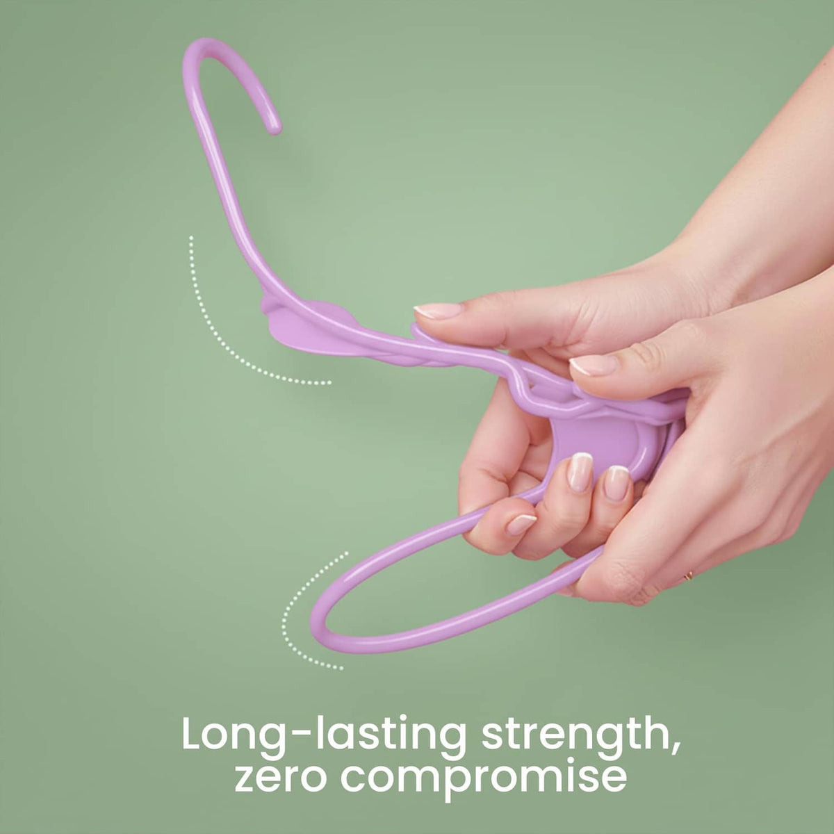 Pink plastic hanger held in hand, curved hook and smooth frame