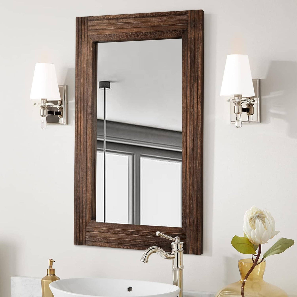 Rustic rectangular wooden wall mirror with dark brown frame, mounted above a sink.