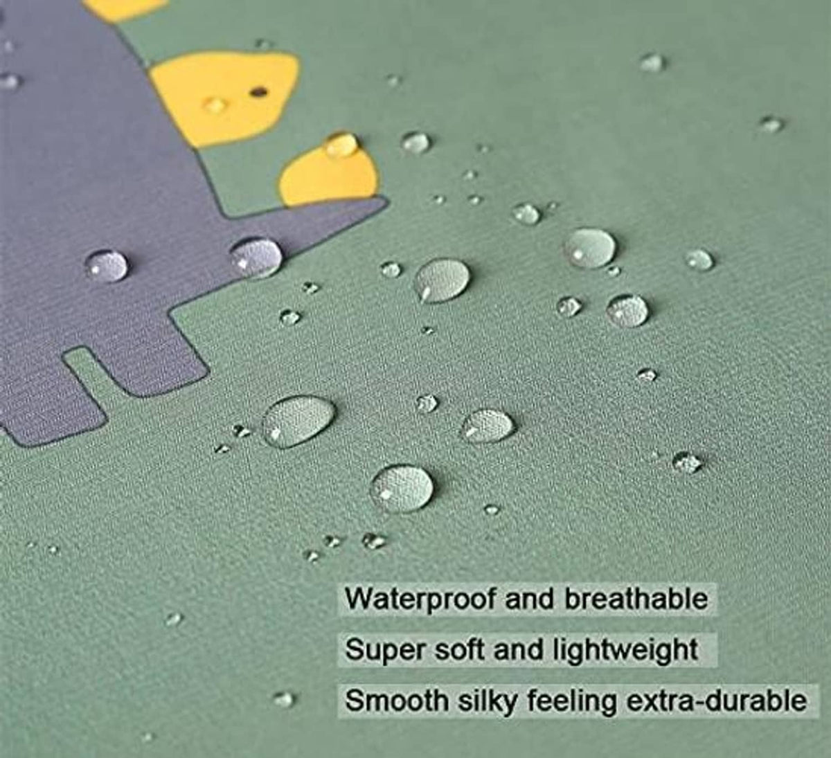 Close-up of textured fabric with water droplets and colorful suit-shaped print.