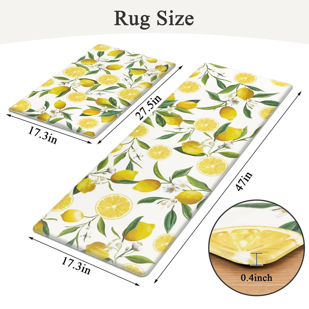 Two white lemon-pattern kitchen rugs laid flat, showing rectangular sizes