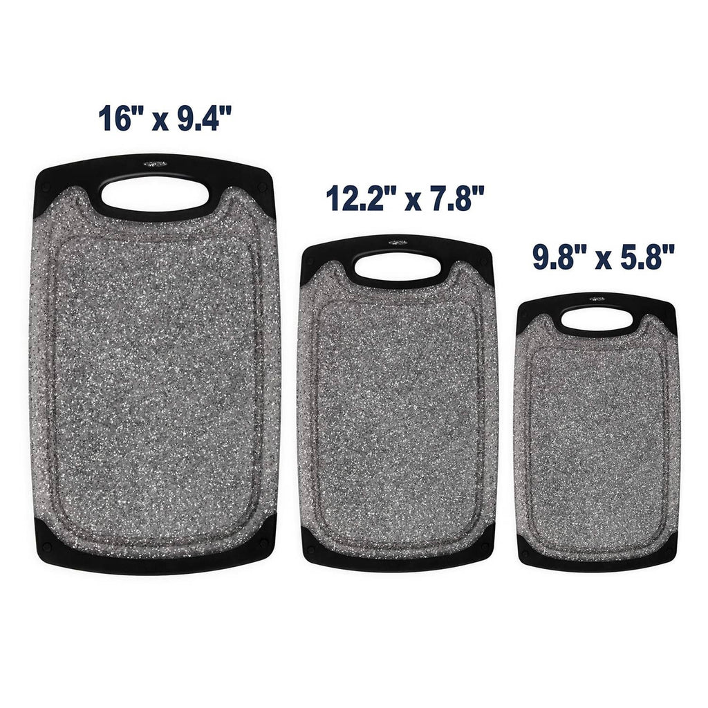 Set of 3 gray speckled cutting boards with black frames, oval handles, and varying sizes
