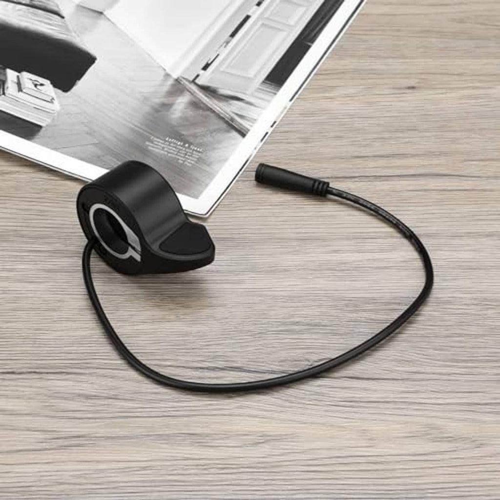 Black thumb throttle speed control with textured thumb lever and coiled cable