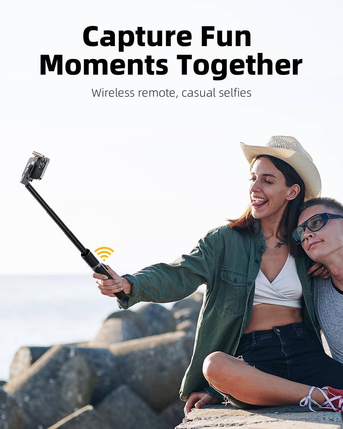Black selfie stick tripod with phone holder and wireless remote control, extended