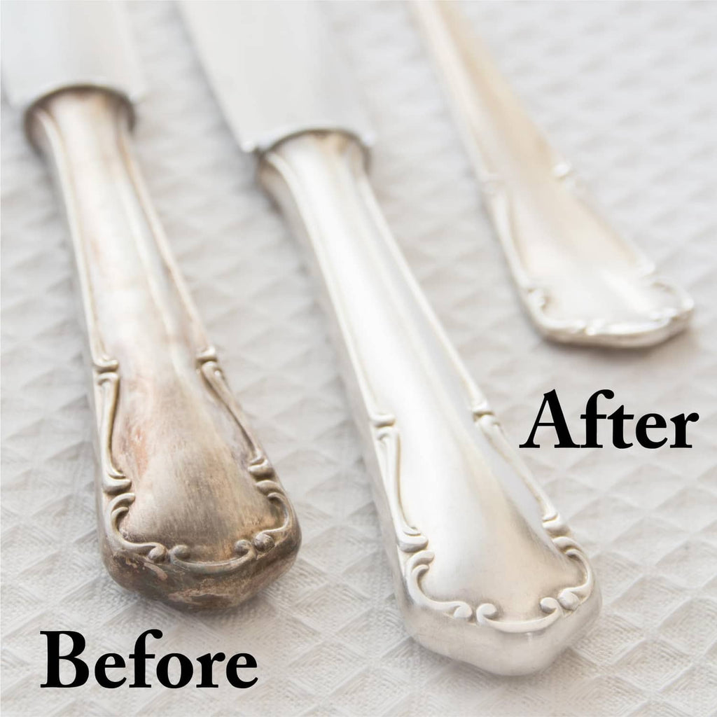 Silver jewelry before-and-after comparison on a polishing cloth surface