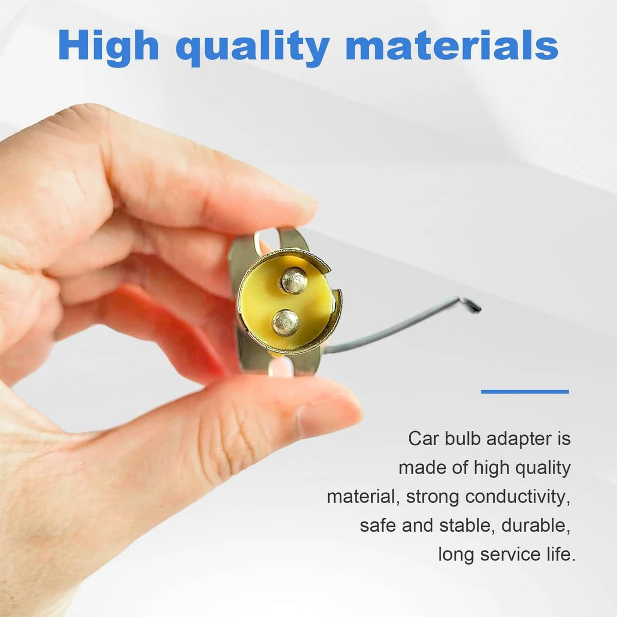 Car bulb socket held in hand, round metal base with two screw contacts and wire