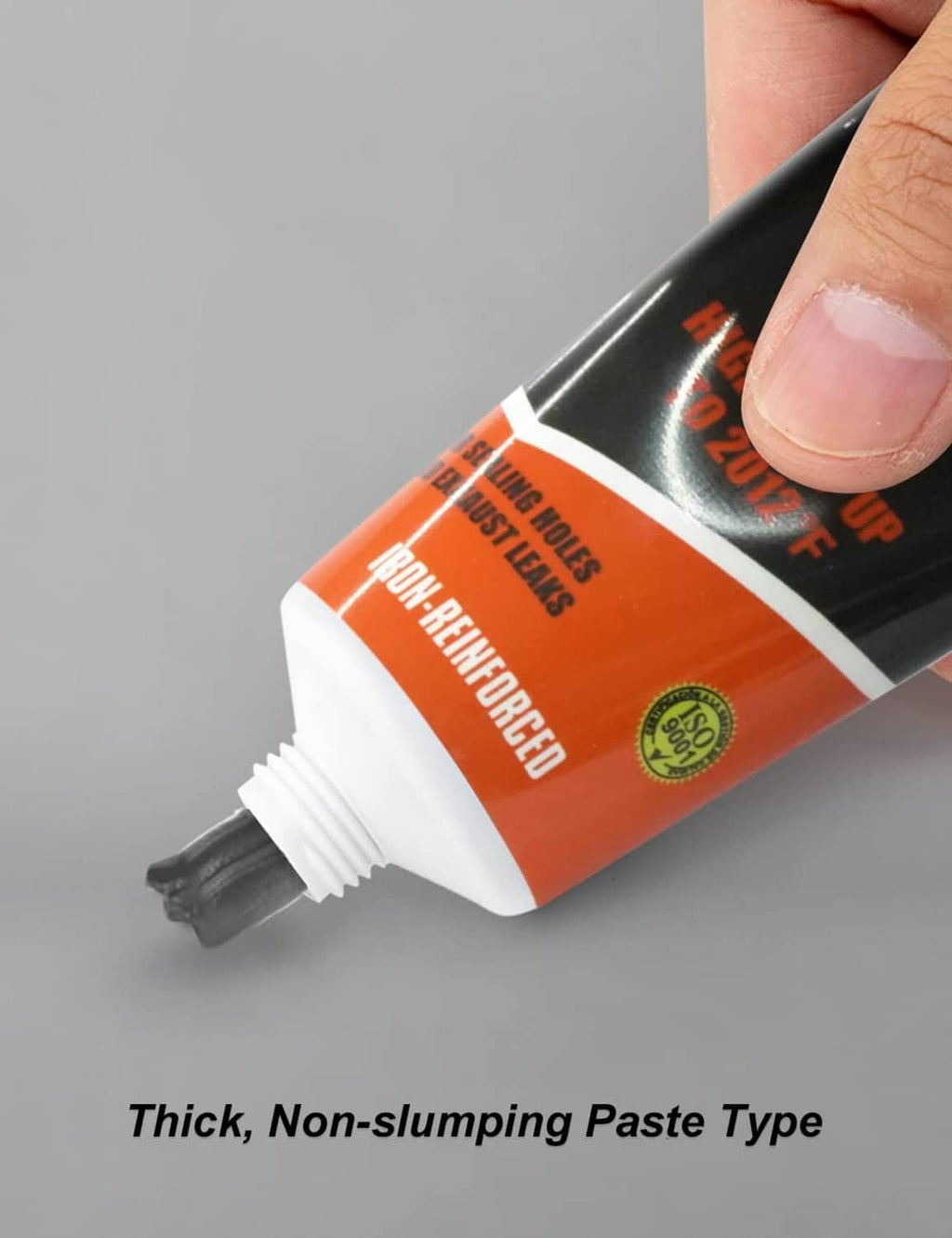 Exhaust system sealant tube close-up, showing orange label section and threaded nozzle