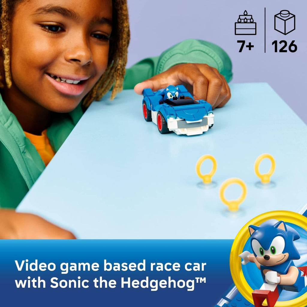 Blue race car toy with Sonic figure and three yellow ring accessories
