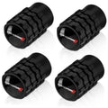 Set of four black tire valve stem caps with raised block texture and Dodge logo