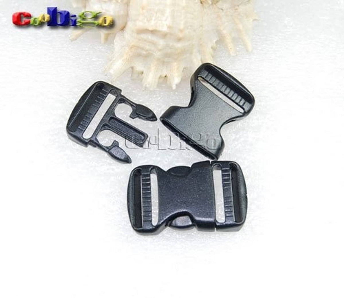 Close-up of dark gray dual adjustable side-release buckles for 3/4 in webbing