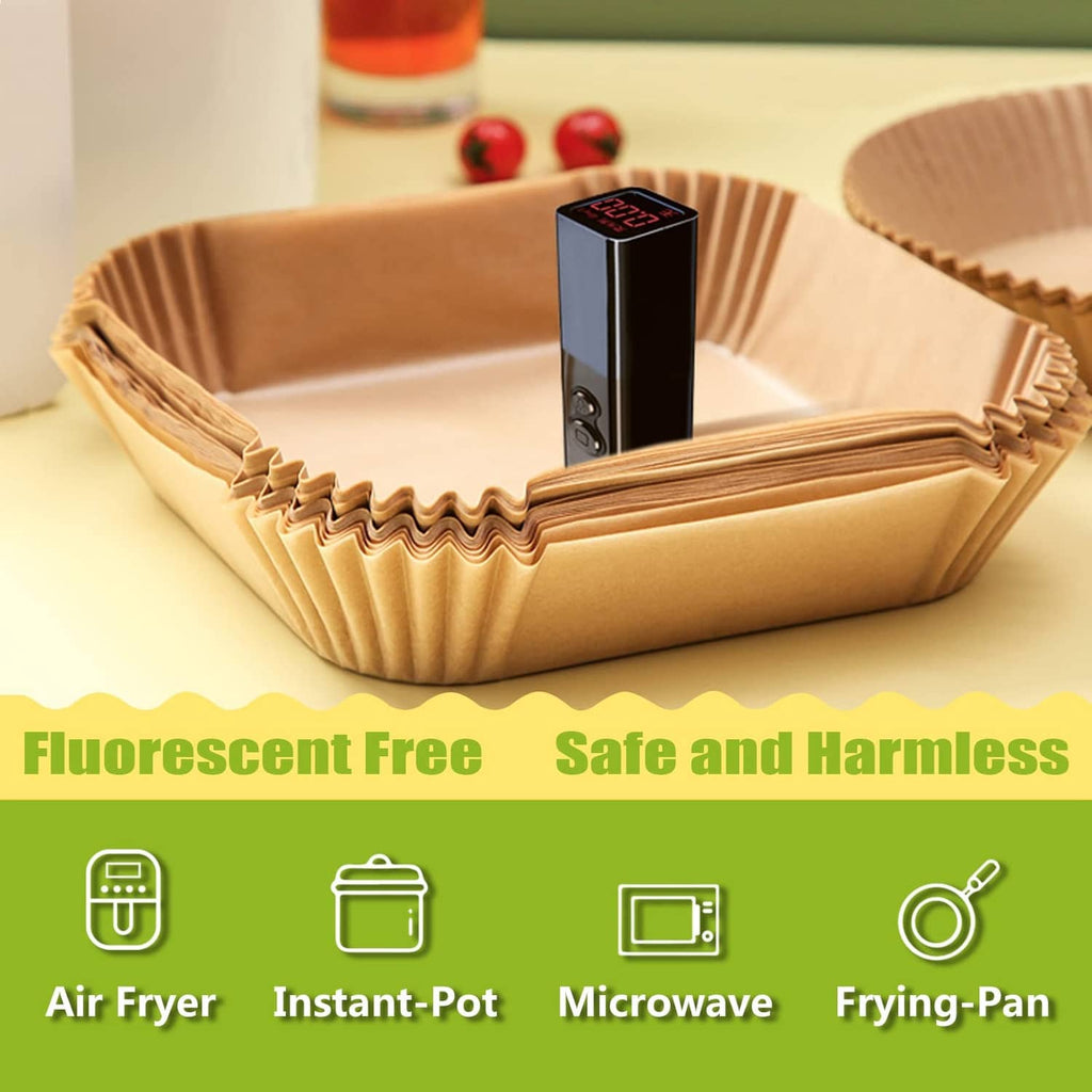 Wood-brown square air fryer liners stacked in a paper tray for storage