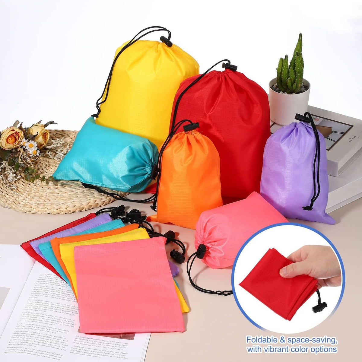 Pink drawstring stuff sack with toggle closure, folded into a smaller pouch