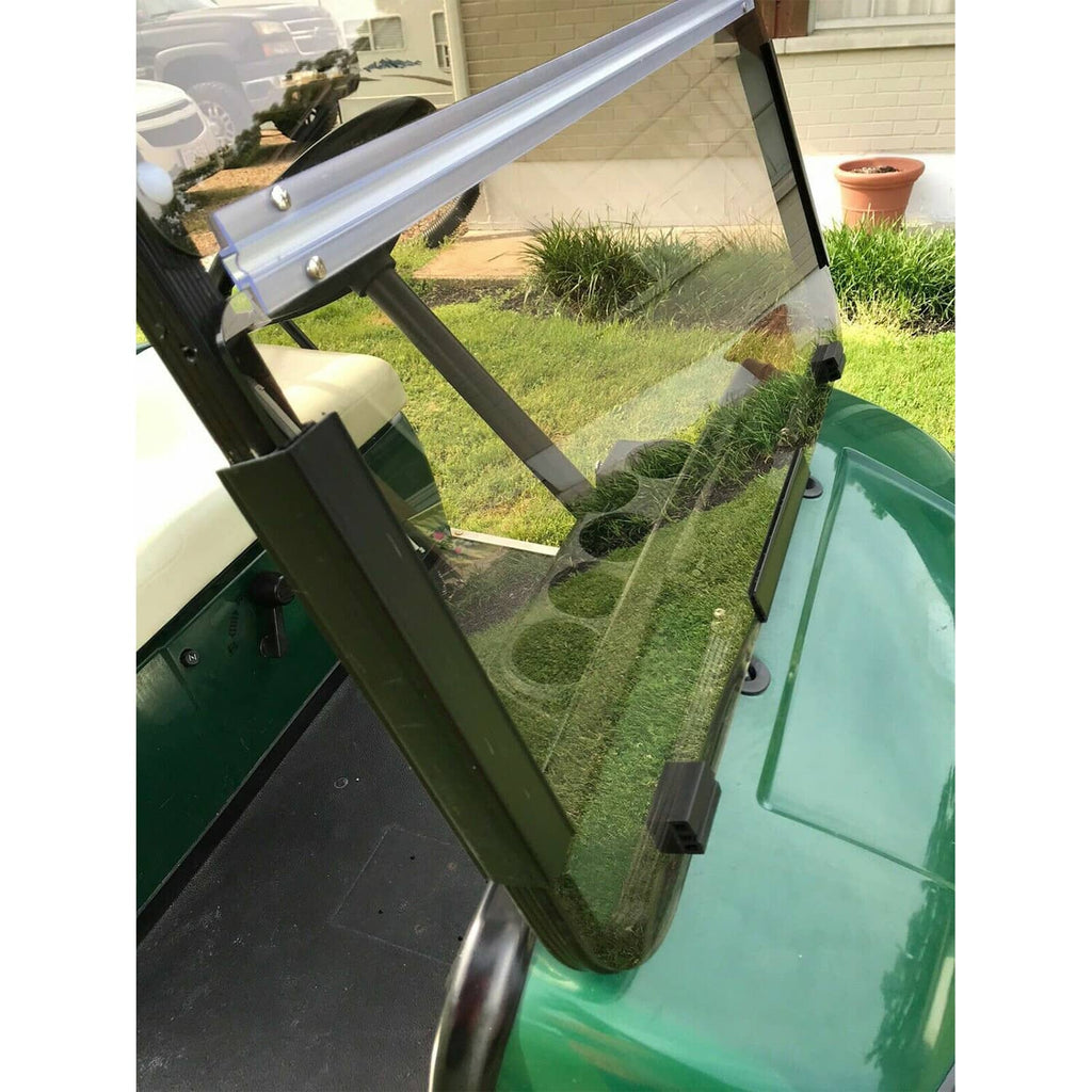 Tinted folding windshield close-up with hinge and transparent side glass panels