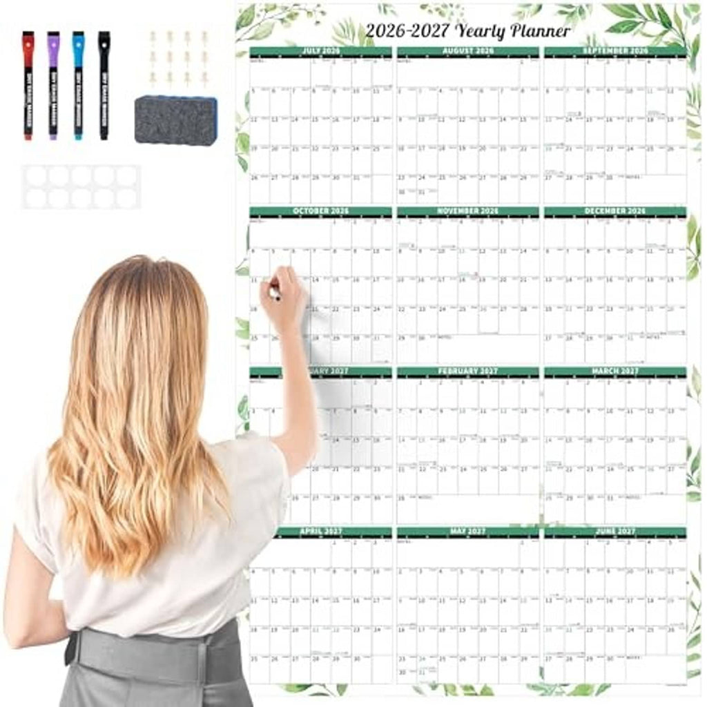 Laminated 2026–2027 wall dry-erase calendar with green plant border and writable grid