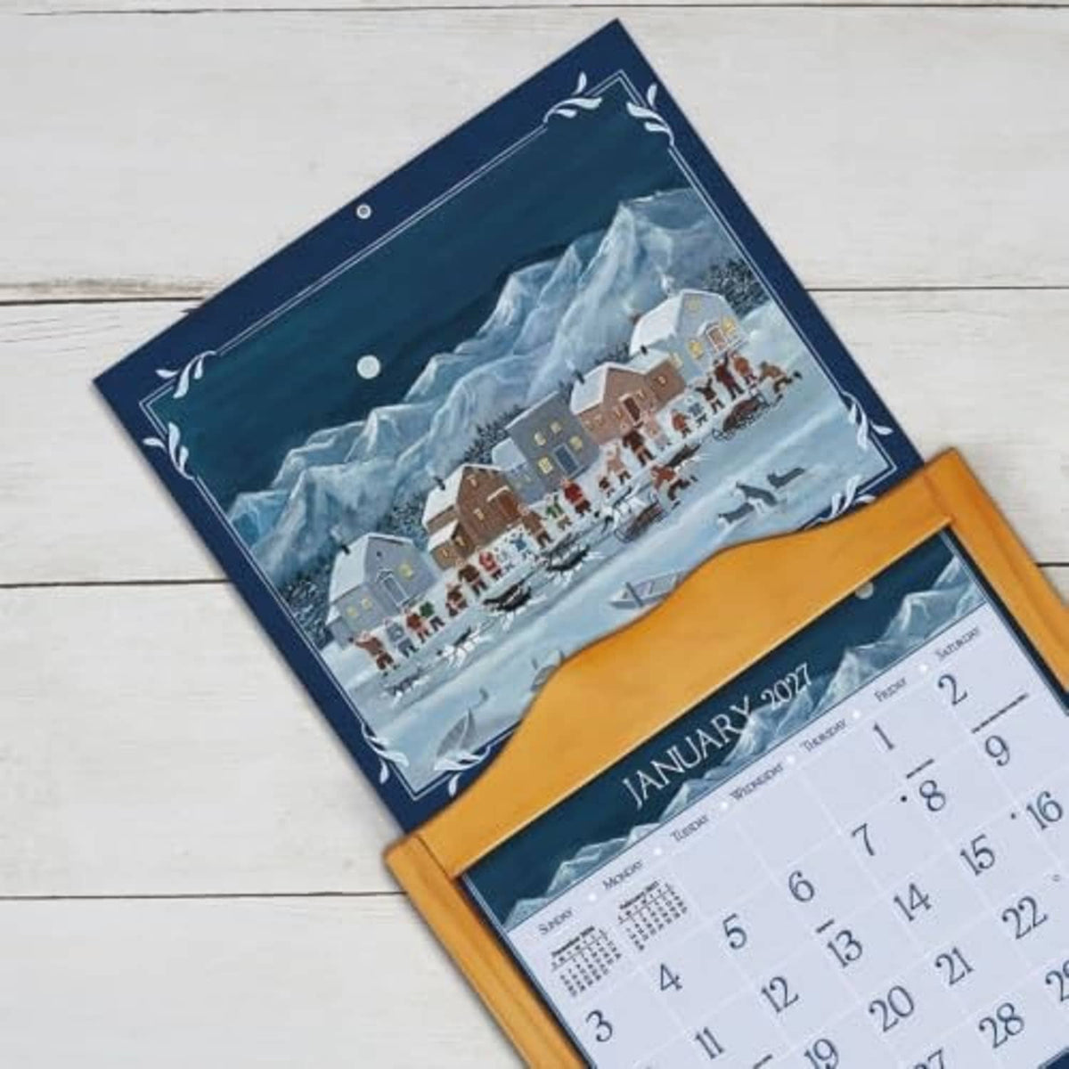 LANG Folk Art 2027 wall calendar with snowy village art and January 2027 page