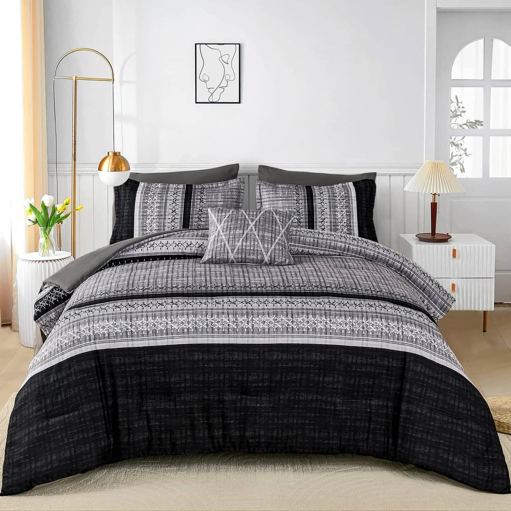 Black and gray comforter set with patterned duvet and matching dark pillowcases