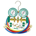 AC manifold gauge set with two green pressure gauges, brass manifold, and red-blue-yellow hoses