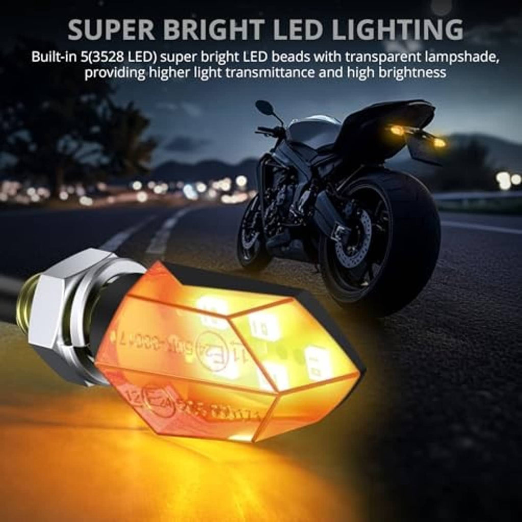 Amber glowing LED motorcycle turn indicator with black housing and chrome threaded base