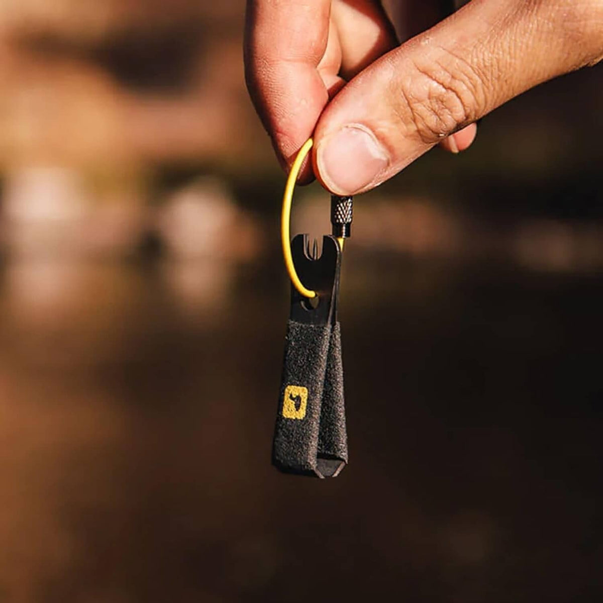 Comfy-grip nippers with yellow cord, tool held upright