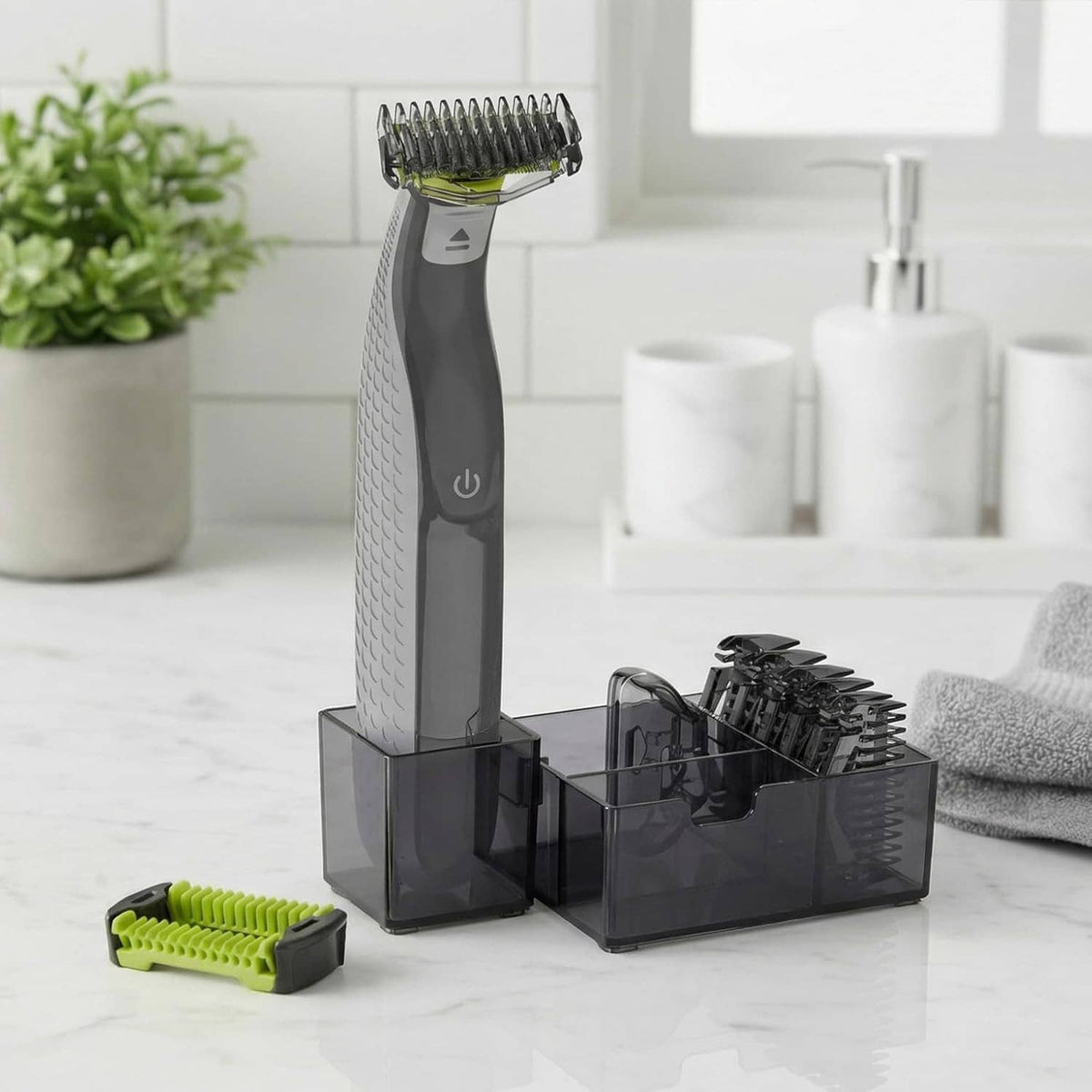 OneBlade trimmer base with lime guide comb and clear organizer holding replacement guards