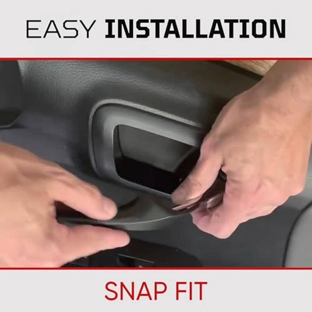 Hands snap-fit a black door handle cover onto a Tacoma door handle recess.