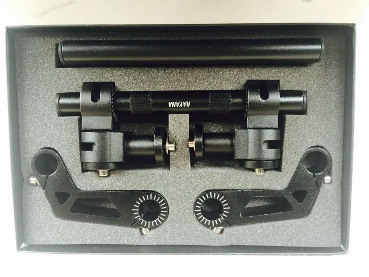 Black adjustable motorcycle handlebar clamp kit in packaging tray