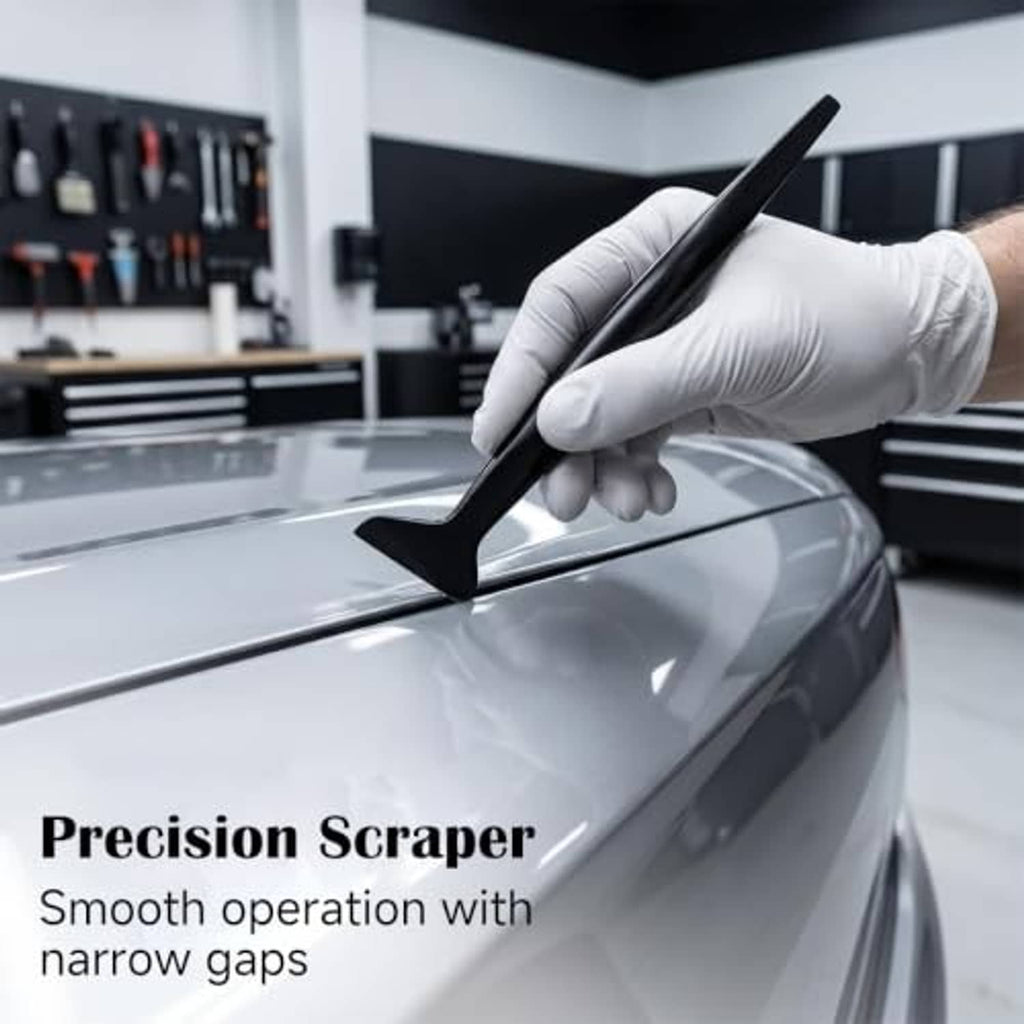 Car tint scraper tool smoothing a window tint film on a vehicle surface