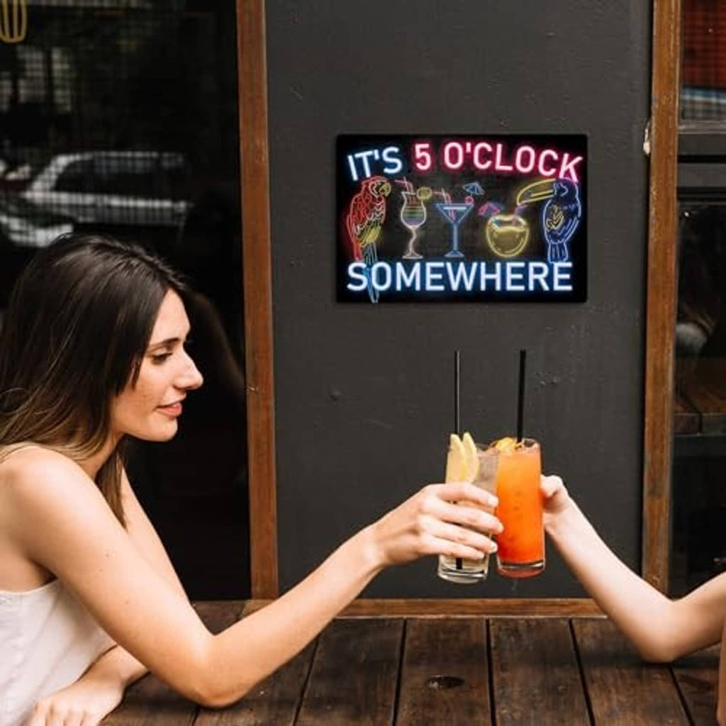 Neon metal tin sign with 'IT'S 5 O'CLOCK SOMEWHERE' lettering and drink icons