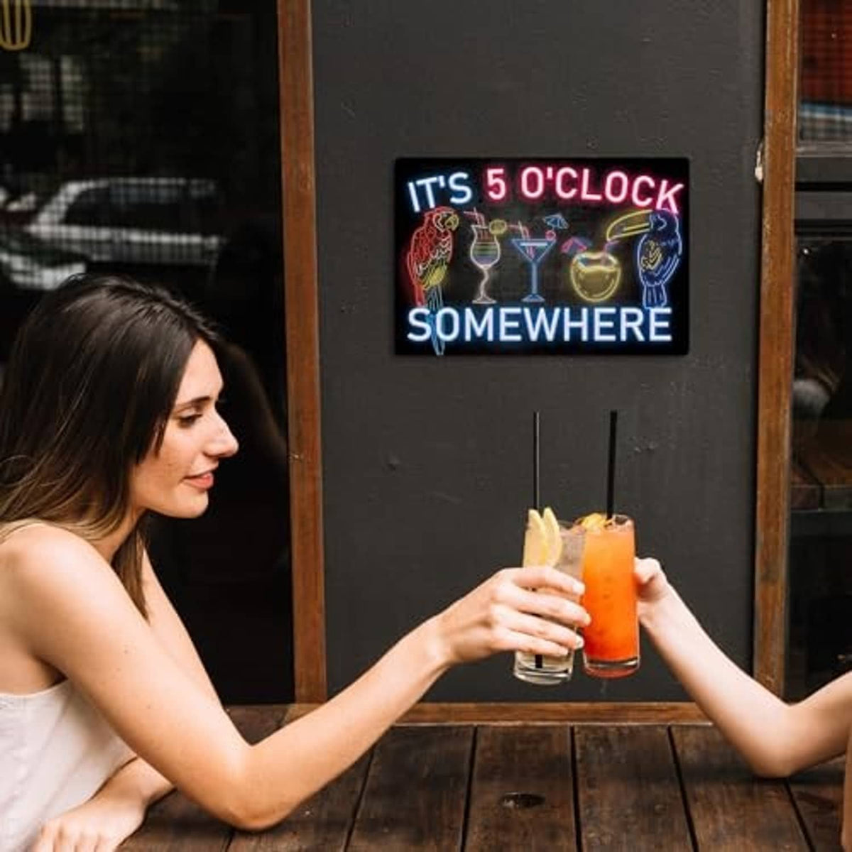 Neon metal tin sign with 'IT'S 5 O'CLOCK SOMEWHERE' lettering and drink icons