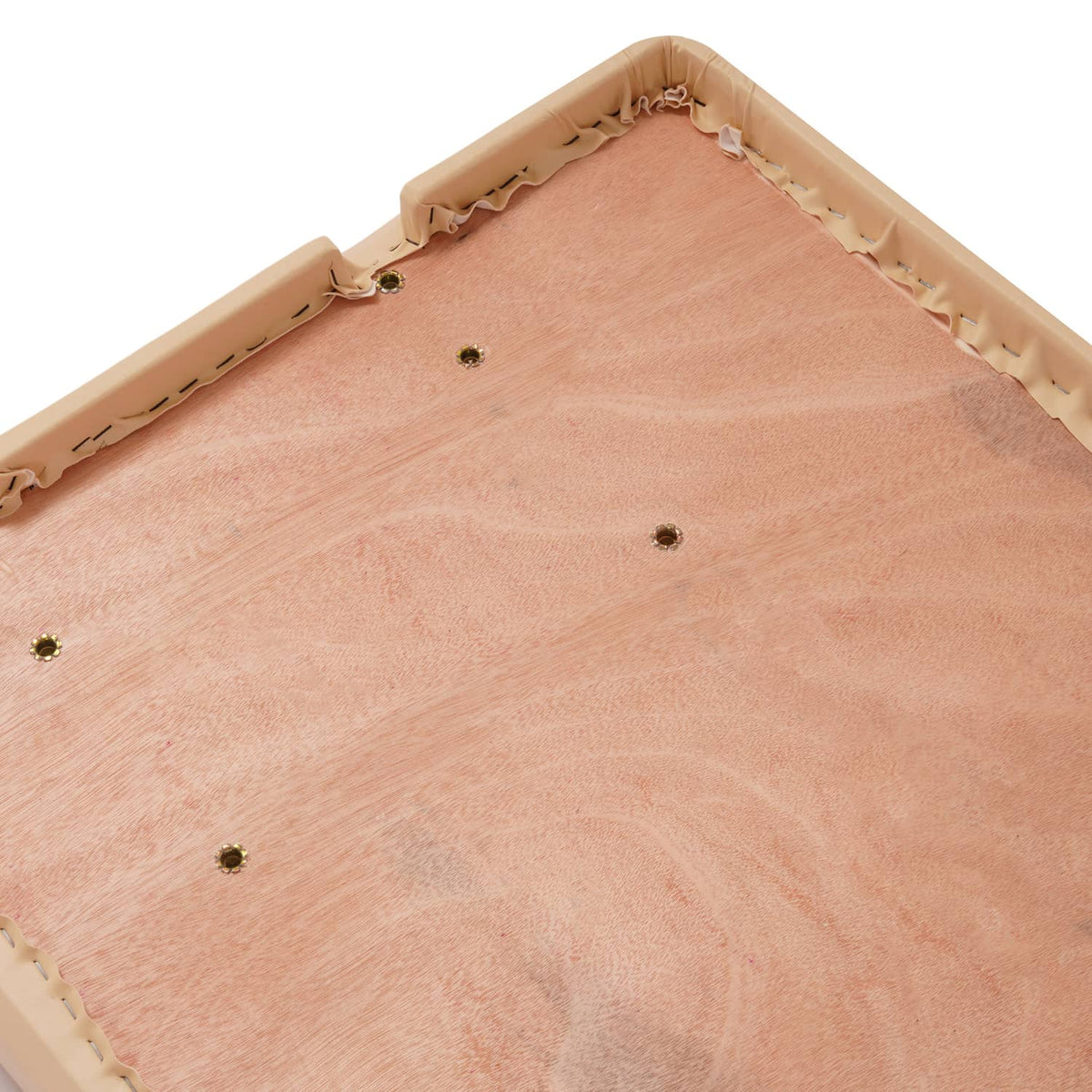 Underside of tan seat bottom with fabric panels and metal mounting points