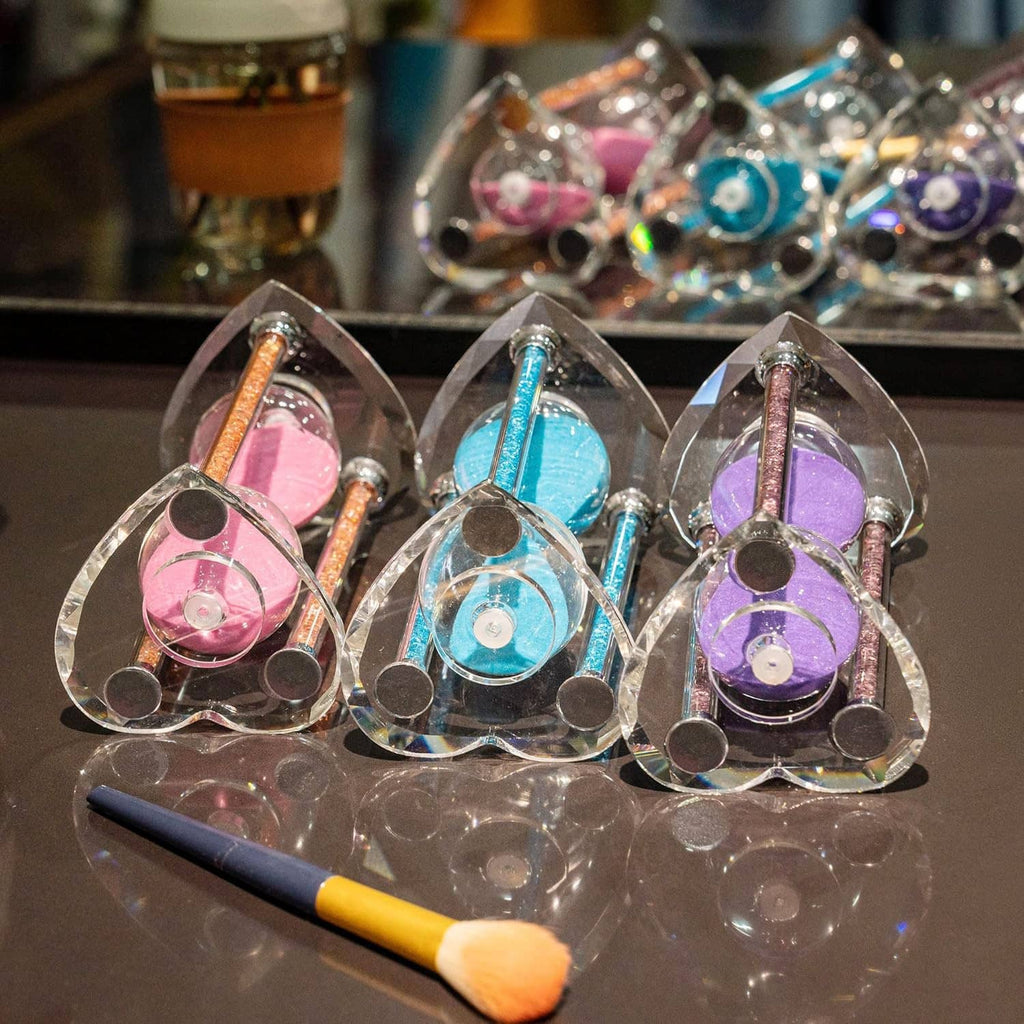 Set of heart-shaped mini sand timers: pink, blue, and purple sand in clear glass domes
