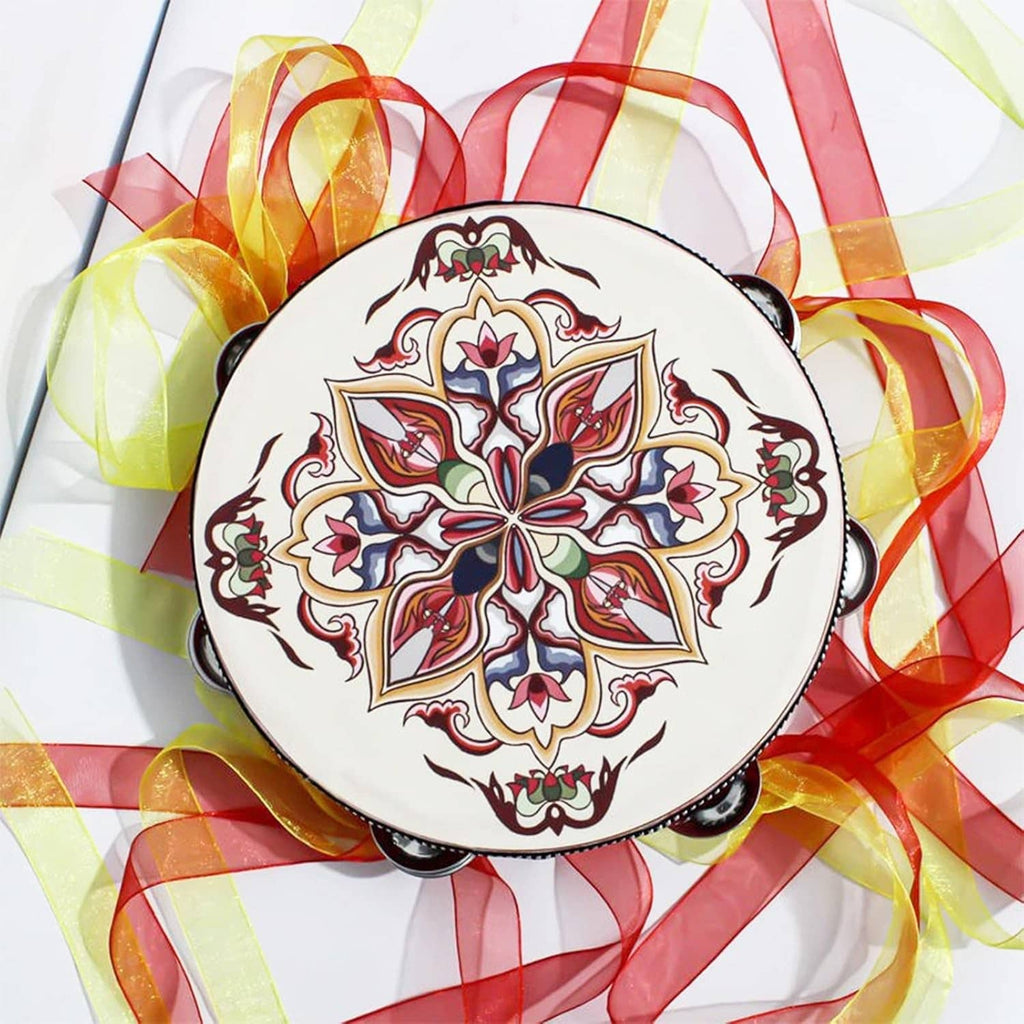 Round tambourine head with floral design, surrounded by colorful ribbons