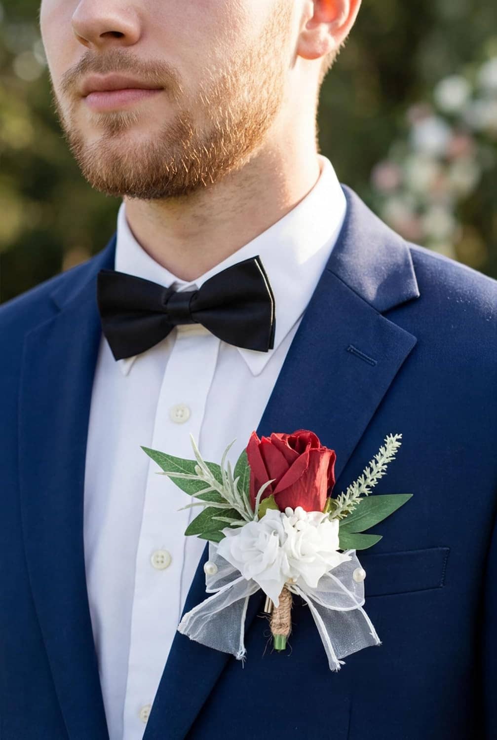 Men's boutonniere pin with burgundy rose, white ribbon, green leaves, faux pearls on gold stem
