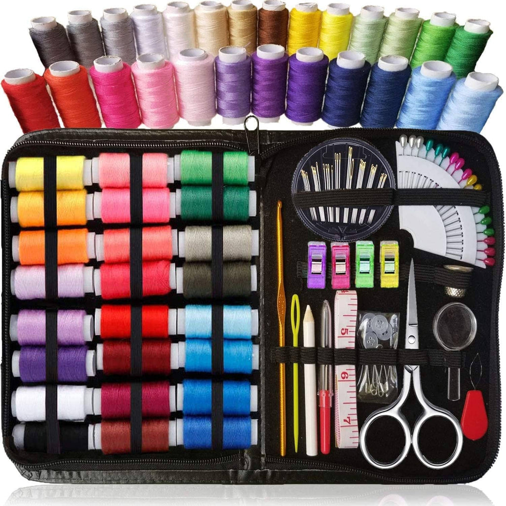 Sewing kit organizer open with multicolor thread spools and assorted tools like scissors and pins