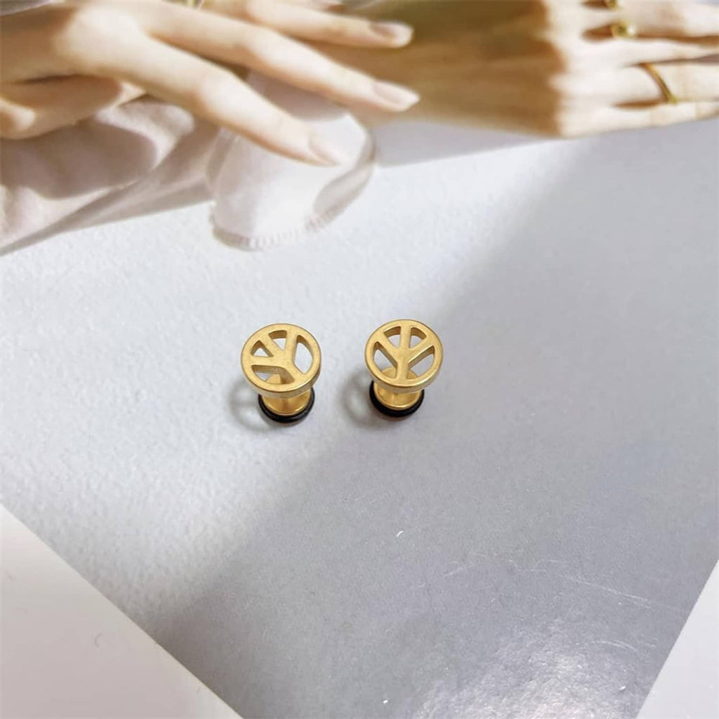 Tiny gold peace symbol stud earrings, round faces with black backing discs