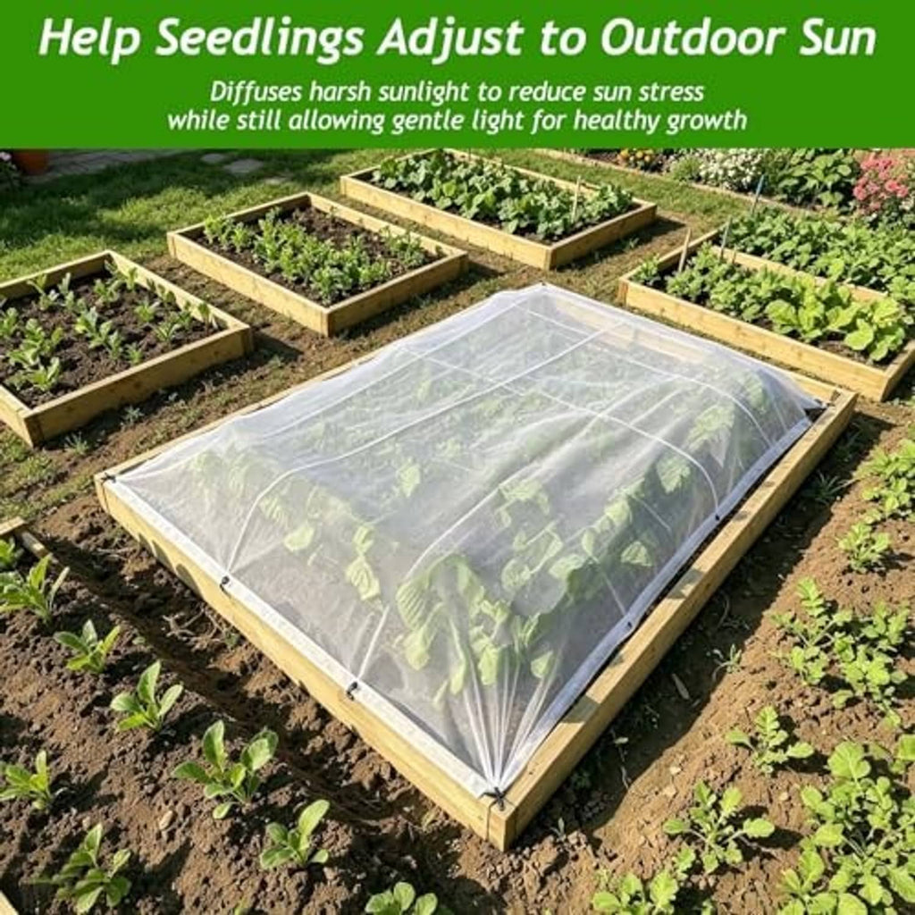 White shade cloth draped over multiple garden beds to diffuse outdoor sun