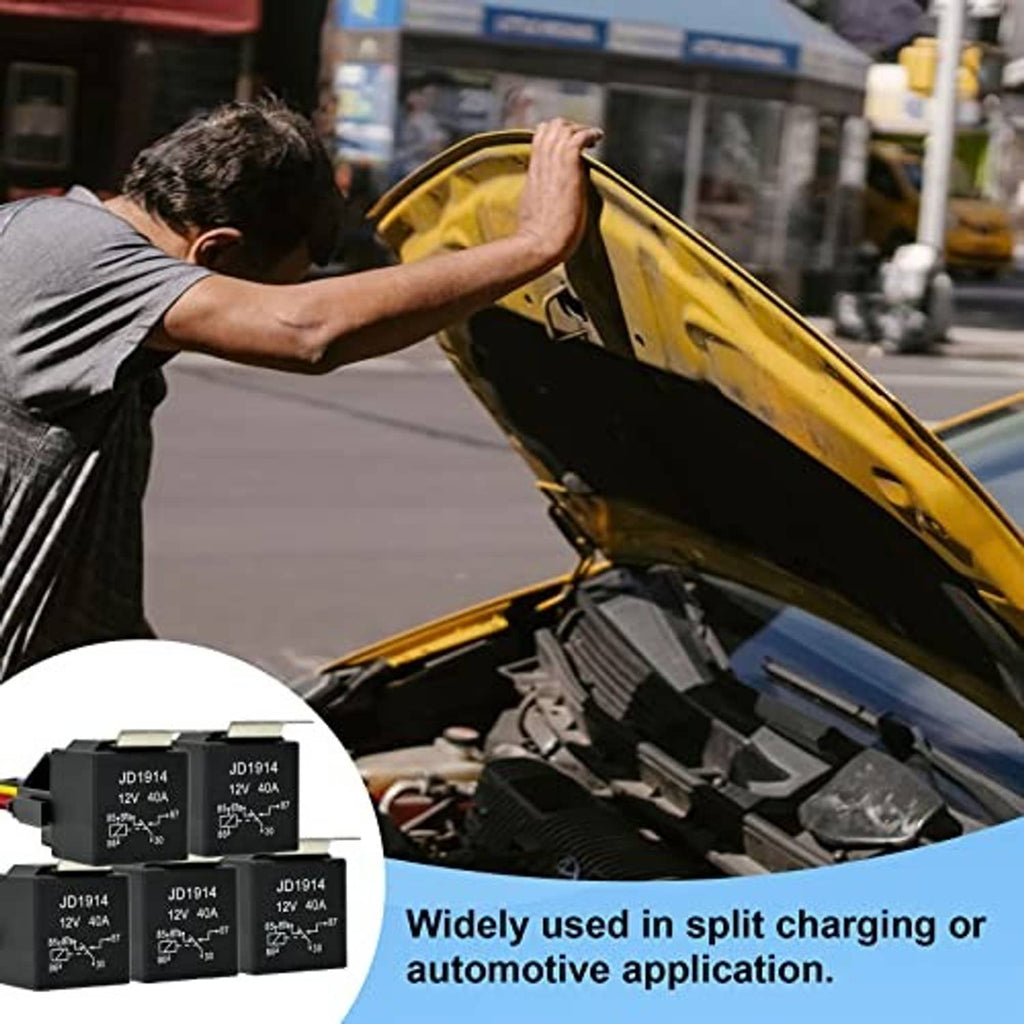 Automotive relay set inset near open hood in a vehicle engine bay