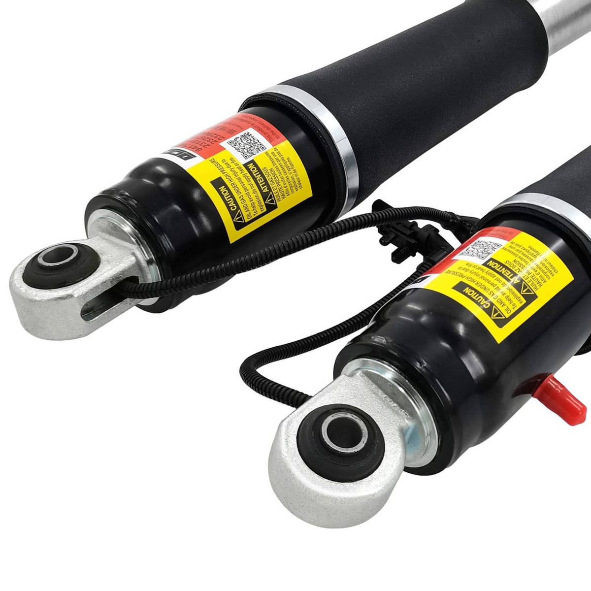 Shock strut with black body, yellow warning label, and metal mounting bracket