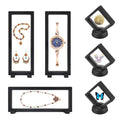 Set of black 3D floating display cases with clear window, holding jewelry and collectibles